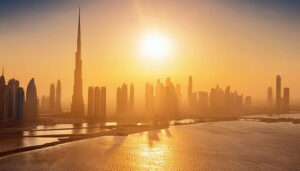 The sun rises, casting a golden glow over Dubai's iconic skyline, highlighting its modern architecture. A breathtaking sunrise illuminates Dubai's skyline, showcasing the city's towering skyscrapers against a colorful sky. 3. The skyline of Dubai is bathed in warm sunlight as the sun rises, creating a stunning view of the city's architecture.